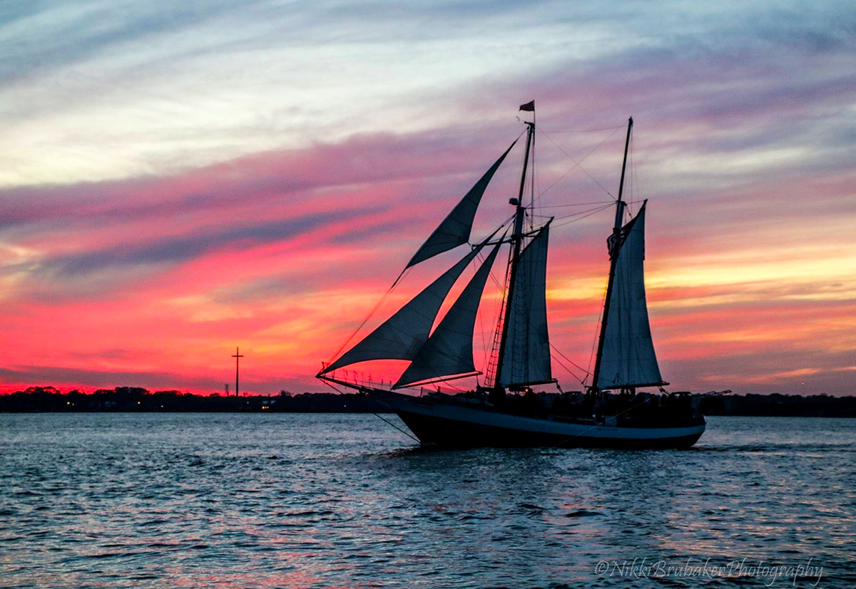 Sunset view looking at the Schooner Freedom sailing